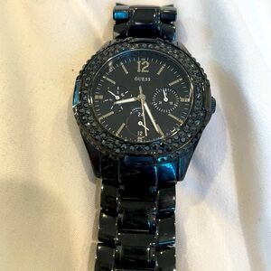 Gorgeous black shiny metal Guess watch with black crystals.